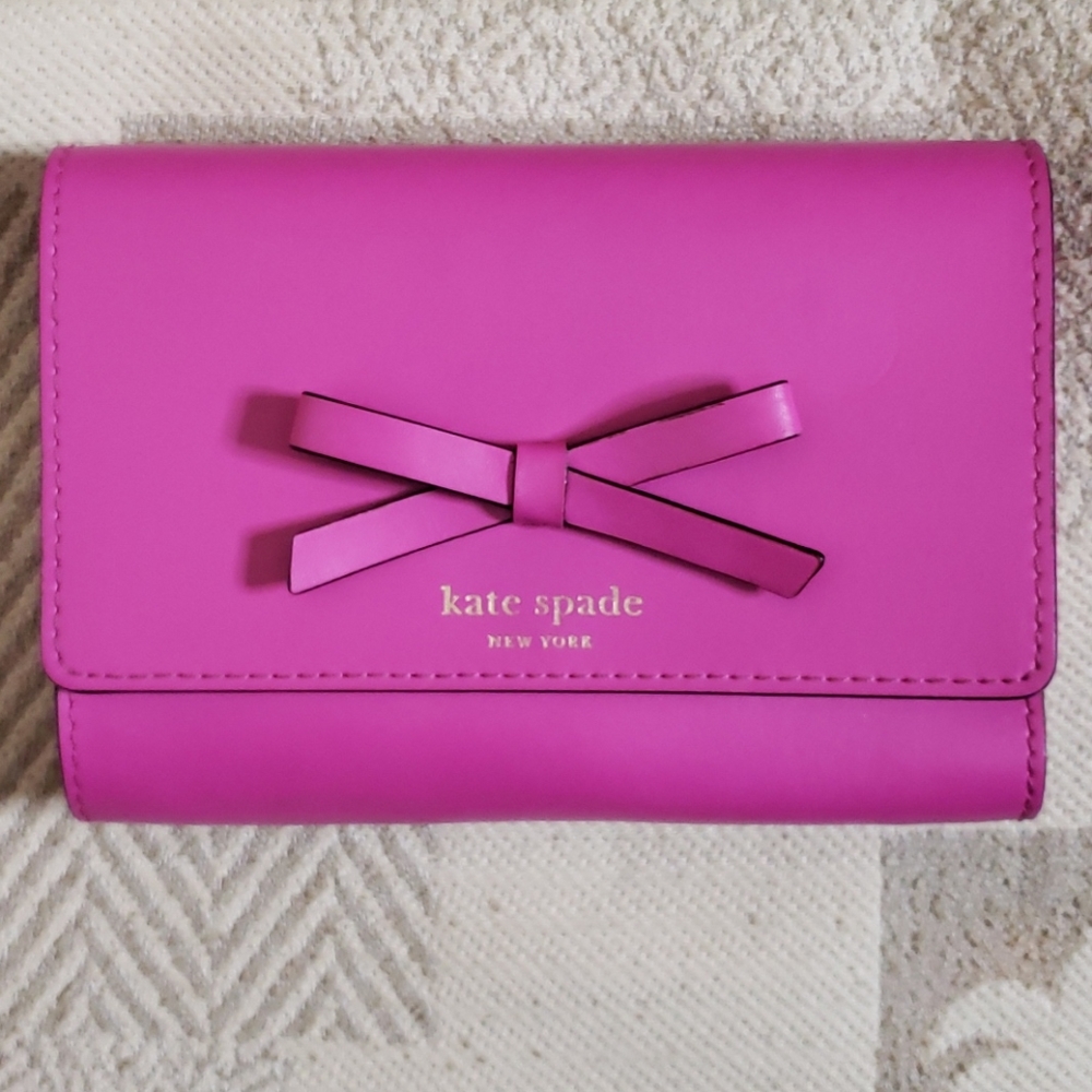 Like new!  Kate Spade hot pink tri-fold bow wallet